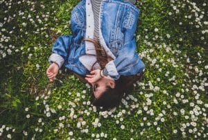 Woman lying on flowers